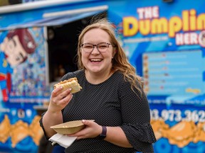 Postmedia journalist Stephanie Babych tries BaoBaos at The Dumpling Hero food truck.