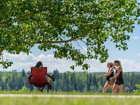 People spent the hot summer afternoon in North Glenmore Park on Tuesday, June 22, 2021. The Weather Network's 2022 summer weather forecast suggest Calgary could be in for some heat, although it shouldn't be as hot as last year.