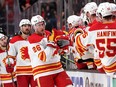 Calgary Flames defenceman Michael Stone is congratulated at the bench after scoring what ended up being the winning goal against the Anaheim Ducks at Honda Center in Anaheim on Wednesday, April 6, 2022.