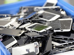 Damaged smartphones are pictured on Nov. 7, 2014 in Paris at the 'Allo Smartphone' company. The company collects and repairs all kind of smartphones before bringing them to the market.