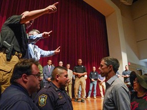Texas Democratic gubernatorial candidate Beto O'Rourke disrupts a press conference held by Governor Greg Abbott the day after a gunman killed 19 children and two teachers at Robb Elementary School in Uvalde, Texas, U.S., May 25, 2022. REUTERS/Veronica G. Cardenas