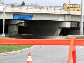A portion of Heritage Dr. SE was closed after a garbage truck struck an overpass, causing damage to the Graves Bridge. Tuesday, May 10, 2022.
