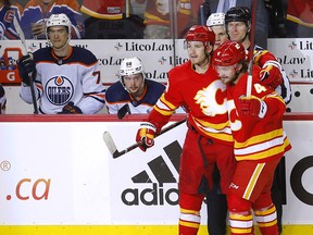 Calgary Flames Matthew Tkachuk celebrates his hat-trick with defenceman Rasmus Andersson as the Flames close out their 9-6 victory against the Edmonton Oilers on Wednesday.