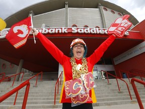 Rachael Knapkin, owner of CGY Team Store located at the Scotiabank Saddledome, shows off some of the new items and is pumped for the playoffs in Calgary on Monday, May 2, 2022.