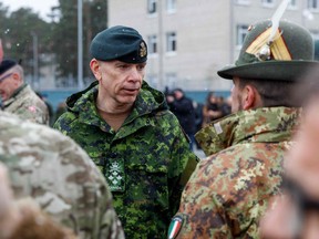 General Wayne Donald Eyre, Canadian chief of the Defence Staff talks with soldiers during a visit of the Adazi military base, north east of Riga, Latvia, on March 8, 2022.