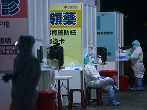 Medical workers staff a newly set up COVID-19 test drive-through site at Liberty Square in Taipei, Taiwan, on May 17.