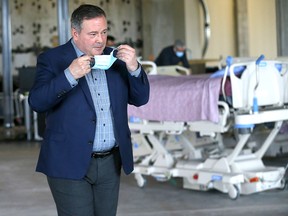 Prime Minister Jason Kenney appears at a news conference at Rockyview General Hospital on Friday.