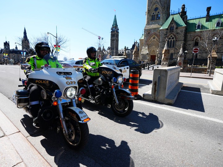  Police patrol Wellington Street in Ottawa prior to the arrival of the “Rolling Thunder” convoy protest on Friday, April 29, 2022.