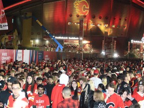 Calgary Flames fans celebrate a win outside the Saddledome after the Flames beat the Dallas Stars 3-1 Game 5 of the Stanley Cup playoffs. Wednesday, May 11, 2022.