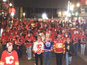 Oilers fans join Flames fans as they celebrate along the Red Mile after the Calgary Flames beat the Edmonton Oilers 9-6 in Game 1 of the second round of the Stanley Cup Playoffs. Wednesday, May 18, 2022.