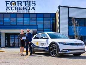 President and CEO of FortisAlberta, Janine Sullivan, and manager sustainability and ESG, Denis Andre.   SERGEI BELSKI