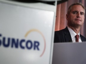 FILE PHOTO: Suncor president and CEO Mark Little prepares to address the company's annual meeting in Calgary on May 2, 2019.