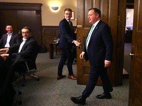 Jason Kenney enters the room prior to a cabinet meeting at McDougall Centre in Calgary on Friday, May 20, 2022.