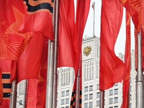 V-Day flags wave in front of Russia's Government building in Moscow on May 11, 2022. The Moscow-installed authorities in Ukraine's southern Kherson region said Wednesday they plan to appeal to President Vladimir Putin for the region to become part of Russia.