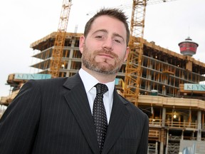 John Fisher, CBRE executive vice president, will help mediate between the city and Flames ownership.