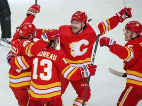 The Calgary Flames celebrate Elias Lindholm’s goal against the Dallas Stars during Game 1 of their first-round playoff series at Scotiabank Saddledome in Calgary on Tuesday, May 3, 2022.