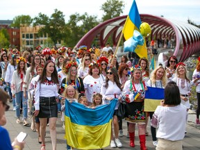 About 250 women walked from the Peace Bridge to Prince's Island Park in Calgary to protest the ongoing Russian invasion of Ukraine on Saturday, May 28, 2022.
