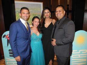 Left to right, Juan Carlos Morales of Dynasty Power, Nancy Cho with Priya and Gaurav Sharma.