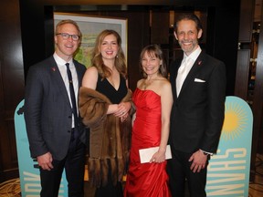 Left to right: OPC supporters Jeff Wollin and Emma Rokosh pose with Claire Stevens and her husband Marc Stevens, CEO of the Calgary Philharmonic Orchestra.