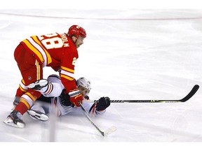 Calgary Flames Elias Lindholm Edmonton Oilers Leon Draisaitl in third period NHL action at the Scotiabank Saddledome in Calgary on Monday, March 7, 2022.