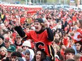 Flames fans celebrate at the Red Lot viewing party ahead of Game 6 between the Calgary Flames and Dallas Stars on Friday.