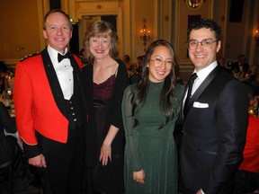 From left to right: Cpt.  Reverend Derwyn Costinak with his wife Wanda Costinak;  with Shizuka Povaschuk and her husband Michael Povaschuk, managing director of RBC Capital Markets.