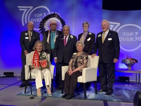 The new Top 7 Over 70 winners were honoured at a gala on May 26, 2022 at the Hyatt Regency Calgary: Front row, seated: Marg Southern and Bonnie Kaplan; back row, left to right: Don Taylor, Miiksika'am (Elder Clarence Wolfleg), Sherali Saju, Louis B. Hobson and Murray McCann. Photo courtesy Top 7 Over 70.