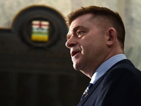 Brian Jean speaks to the media after being sworn in as an MLA at the Alberta Parliament in Edmonton on April 7, 2022.