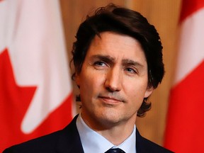 Canada's Prime Minister Justin Trudeau attends a news conference to announce that the Emergencies Act is being revoked after Canadian police evicted the last of the trucks and supporters occupying the downtown core in a protest against the coronavirus disease (COVID-19) vaccine mandates, in Ottawa, Ontario, Canada, February 23, 2022. REUTERS/Patrick Doyle