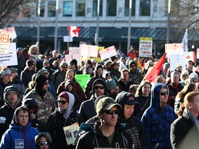 Hundreds gather near Calgary City Hall to protest COVID-19 restrictions on Nov. 28, 2020.