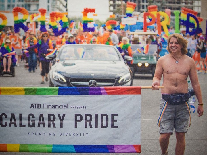  Pictured is a photo of Ace Peace leading the Calgary Pride parade in in 2019 in his mother Lindsay Peace’s office, executive director of Skipping Stones on Thursday, May 26, 2022. Photographed photo is by Benjamin Laird.