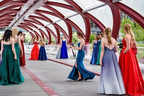A group of friends and classmates from Notre Dame High School celebrate their graduation at Peace Bridge on May 29, 2022. Azin Ghaffari/Postmedia