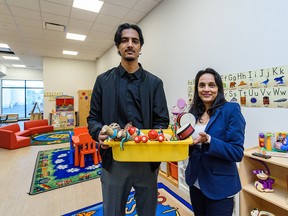 Ibrahim Aijaz, administration assistant, left, and Mina Subedi, office administration assistant, pose for a photo at the daycare at Centre For Newcomers’ new facility during a tour on its grand opening on World Refugee Day on Monday, June 20, 2022.