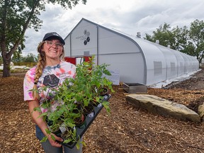 Heather Ramshaw, operation manager at Highfield Farm, is all smiles at the grand opening of the new greenhouse on Friday.