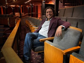 Rohit Chokhani, artistic and executive director of Alberta Theatre Projects,sits in the Martha Cohen Theatre.  Photo by Jennifer Merio
