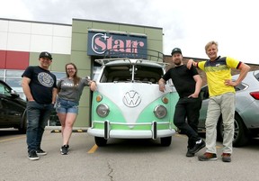 Starr Distilling founder Mike Stanfield, general manager Holly Burdess, chef Kyrin Wollen and master distiller Cody Wollen pose with a vintage VW truck at Starr Distilling. Jim Wells/Postmedia