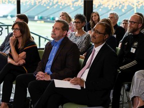 Traci Bednard, CEO of Explore Edmonton, left, city manager Andre Corbould and Mayor Amarjeet Sohi react after Edmonton was not chosen to host any FIFA World Cup 2026 games during a watch party at Commonwealth Stadium in Edmonton on Thursday, June 16, 2022.