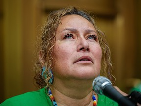 Melody Ayoungman-Hunt speaks with media outside the Calgary Courts Center on Monday, July 26, 2021.