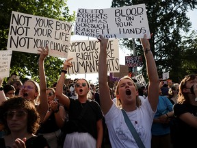 Abortion rights demonstrators protest outside the U.S. Supreme Court, which overturned the landmark Roe v Wade abortion decision in Washington on Friday, June 24, 2022.