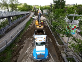 Memorial Drive was shut down between 3 St. and 10 St. N.W. as City crews removed the berm after flood fears evaporated in Calgary on Saturday, June 18, 2022.