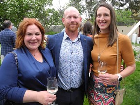 From left: Caley Remington and her husband Ryan Remington of Remington Development Corporation with community supporter Lesley Alexander.