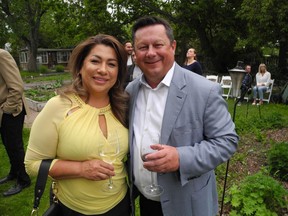 Brooks: Rouge Garden Party raises money for men and girls Lucia Ocampo of WestJet and Justin Bobier of her husband Crystal Creek Homes.