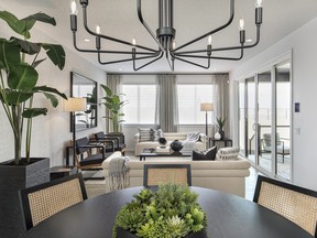 The dining room in the Emerson 28 show home by Jayman Built in Precedence in Riversong, Cochrane.