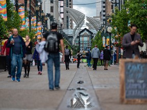 If downtown is to evolve, a key undertaking is to bring more people into the area. Here, people stroll along Stephen Avenue.