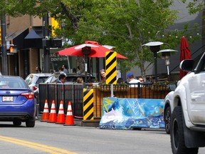 Extended patios on Kensington Road in Calgary on Thursday, June 9, 2022. The city's proposed Neighbourhood Streets Policy will help create clear guidelines for patios that extend into roadways as the city tries to encourage people to get out and use the space in their neighbourhoods.