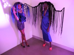 Models Amina, left, and Nyaluak sport eye-popping hair art created by Jerome Salon’s Janice Adshade.