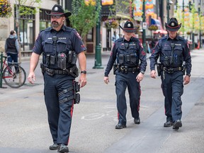 Cst. Brad Milne and fellow officers patrol Stephen Avenue. In 2021, violent crime hit a five-year high in Calgary.