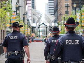 Calgary police officers patrol Stephen Avenue on Monday, May 30, 2022.