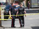 FILE PHOTO: Calgary police investigate a shooting in an alley in the 1000 block of 17th Avenue SW on May 23, 2022. 