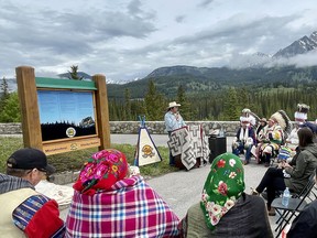 Representatives from Siksika Nation and Parks Canada attend the unveiling of new signs at Castle Mountain on June 17, 2022, affirming the Siksika's historical presence in the area.